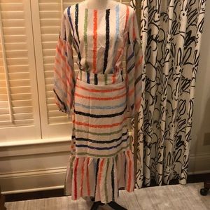 Top and skirt with ruffle at hem and sheer sleeve